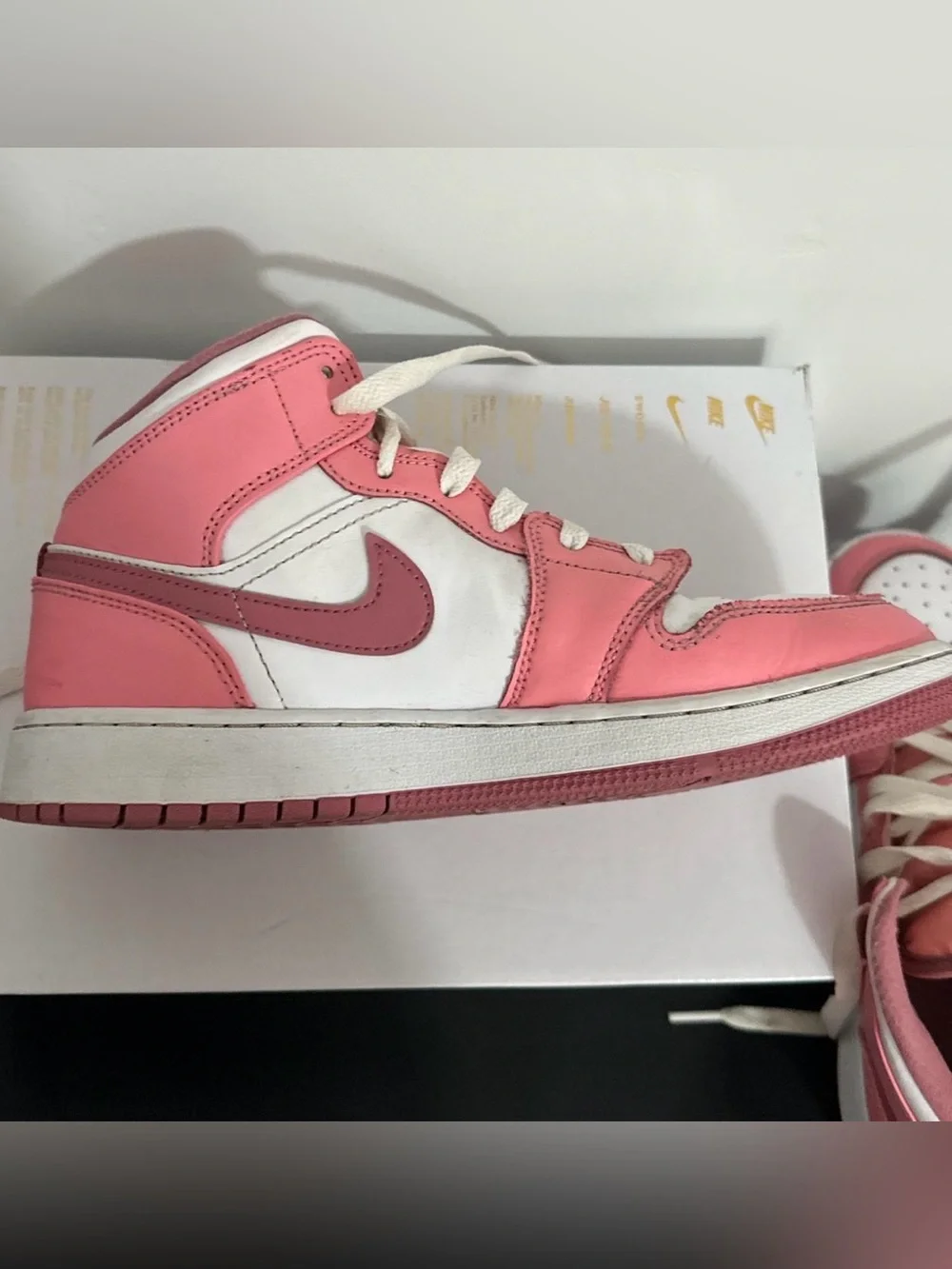 Jordan 1 Kids Pink and White Mid-Top Sneakers with Dark Pink Swoosh